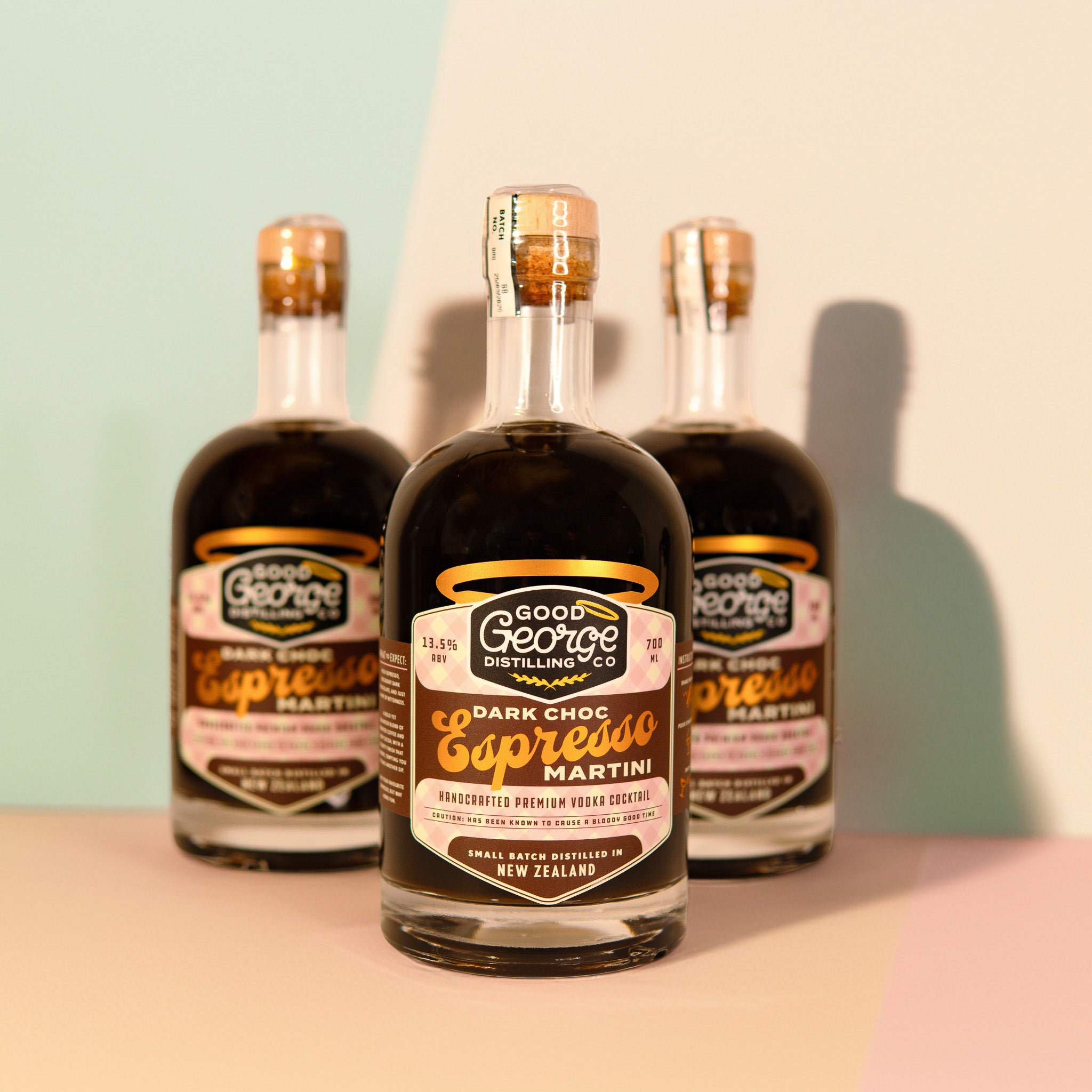 Three bottles of Good George Distilling Co. Dark Choc Espresso Martini on a light background