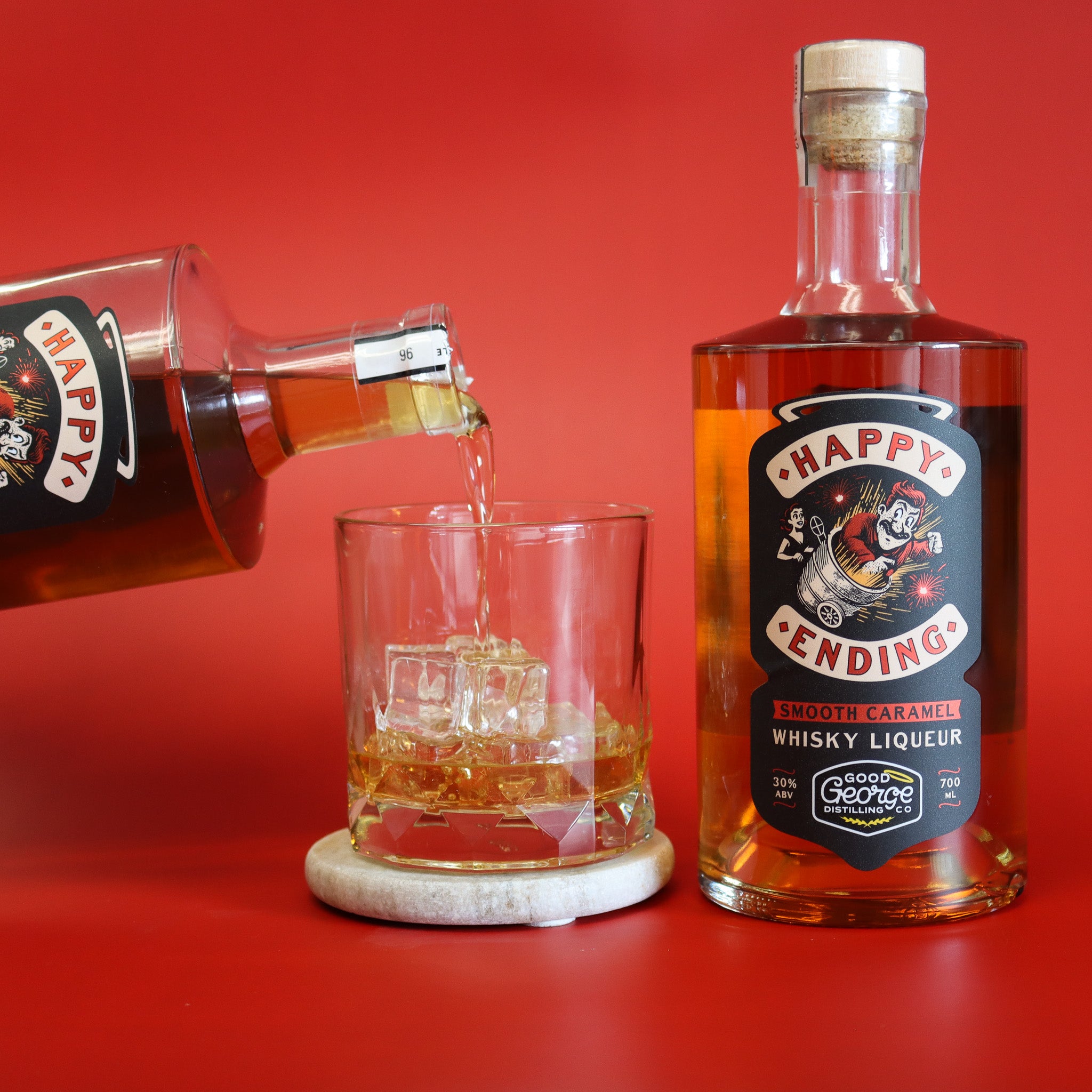 Happy Ending whisky liqueur being poured into a glass with a red background