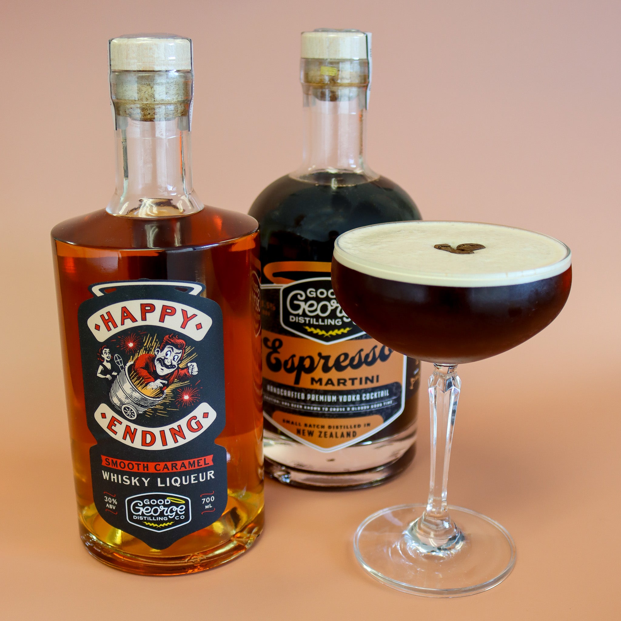 Two bottles of Good George's Distilling liqueur and a martini are combined into a cocktail on a peach background