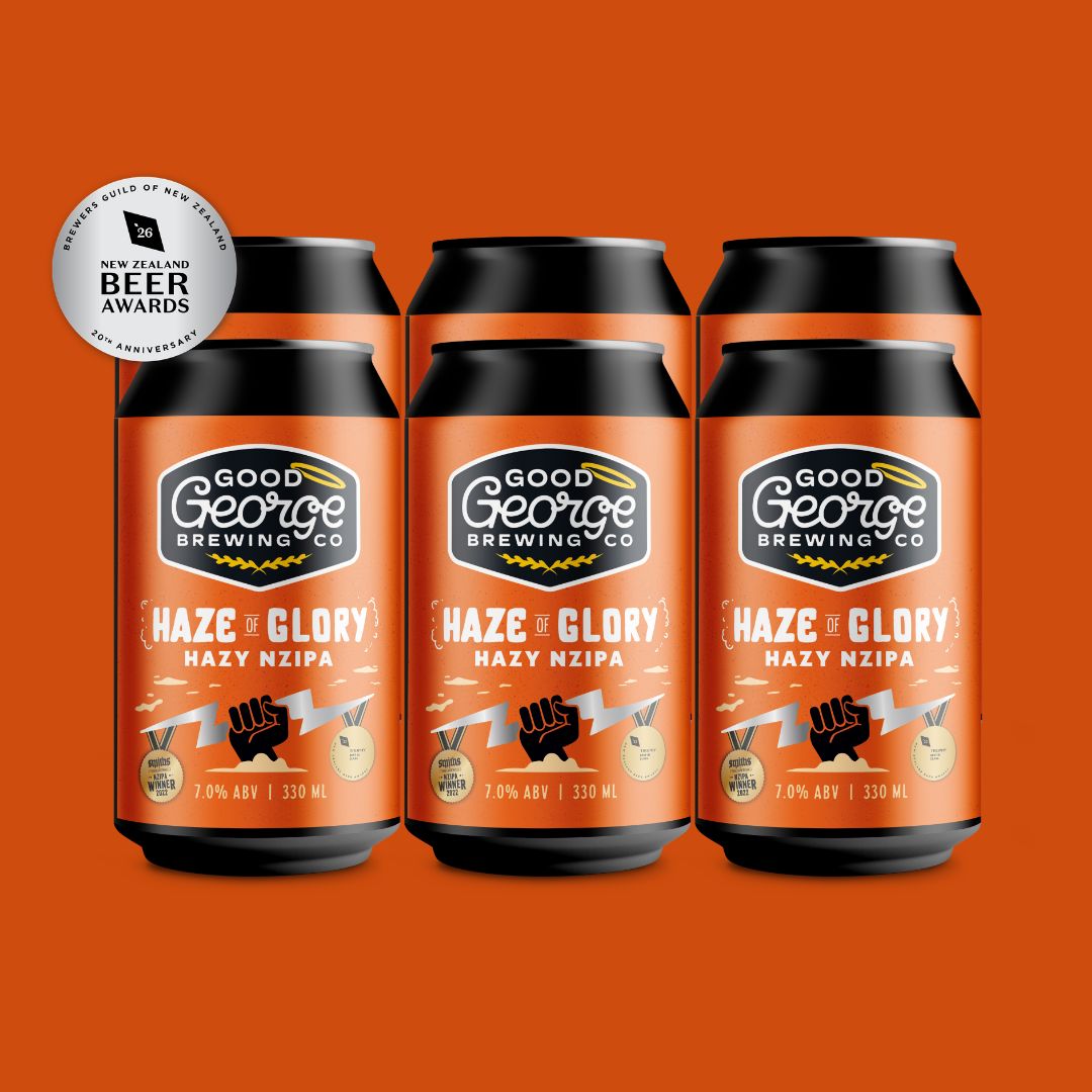 Three cans of Good George Brewing Co. Haze + Glory Hazy Nzipa beer arranged side by side on a solid orange background, with a silver Best Beer Awards 2026 seal in the top-left corner.