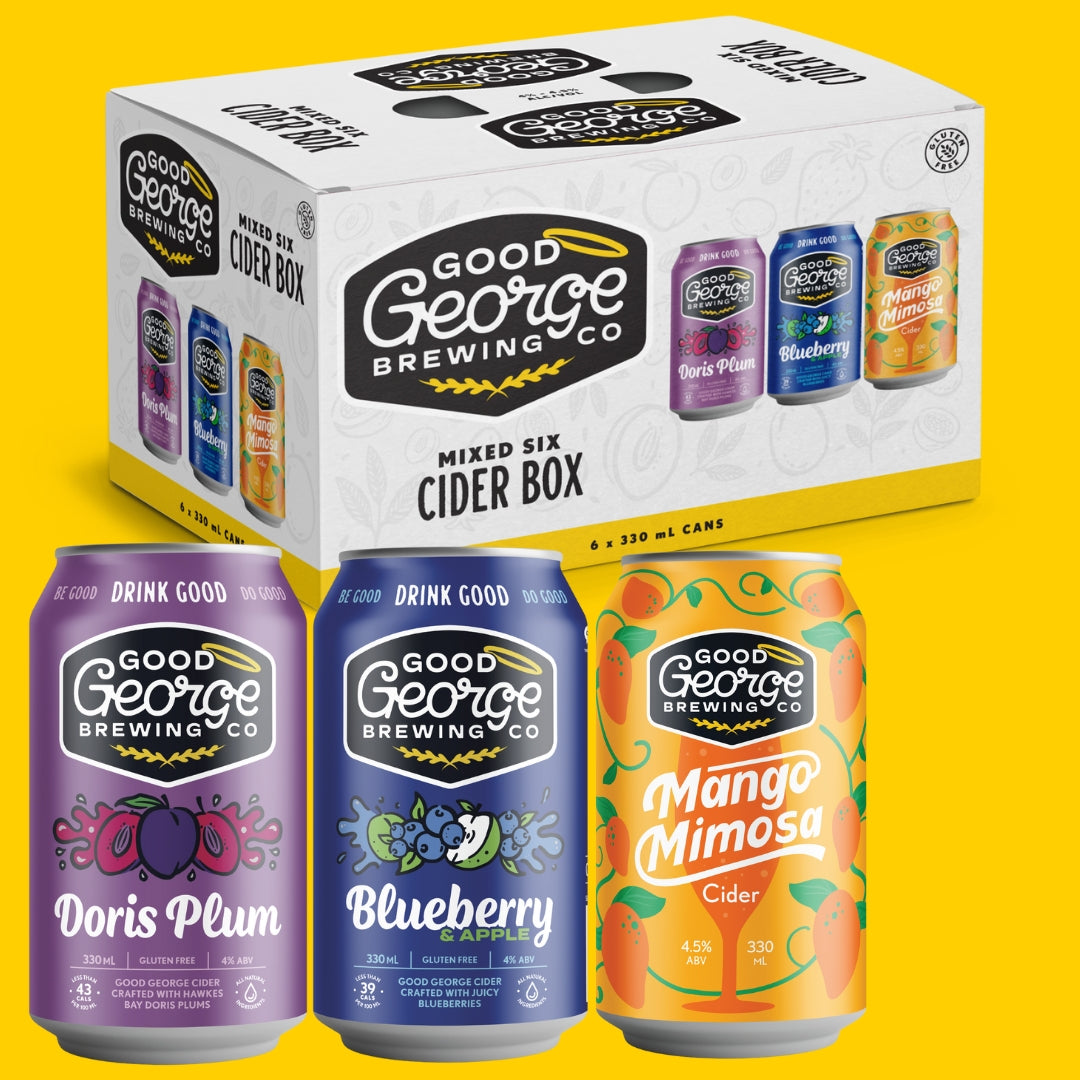 A pack of Good George Mixed Six Cider Favourites, featuring three different flavored cider cans with vibrant and colorful designs on them. The packaging is predominantly white with the brand name and product title, and the cider cans are displayed in front with clear visibility of the labels.