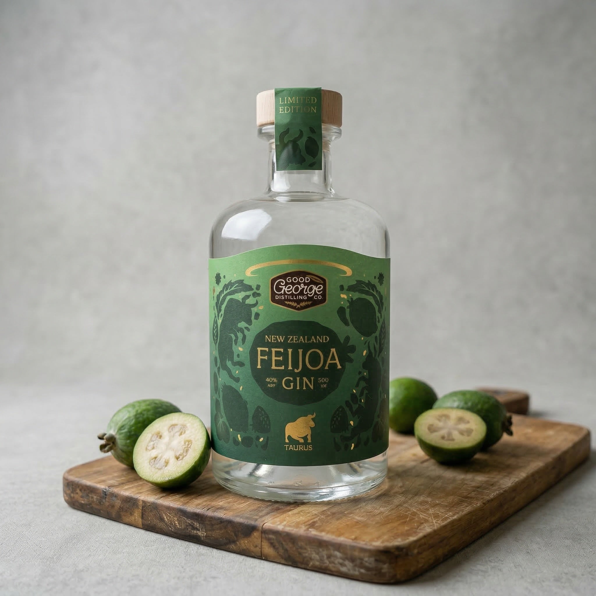 Bottle of New Zealand Feijoa Gin on a wooden cutting board with feijoas.