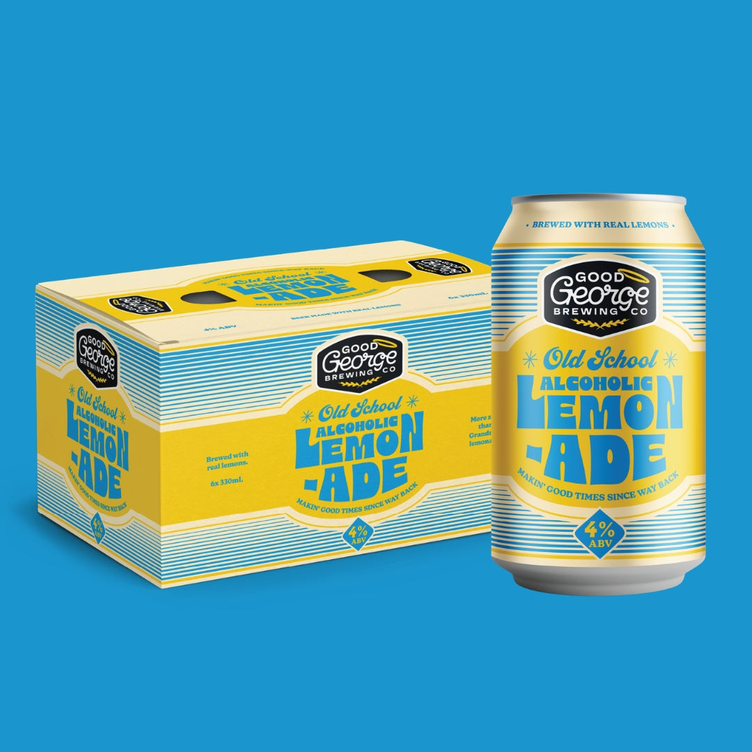 A can and matching box of Good George Brewing Co. Old School Lemon Ade alcoholic beverage, shown on a solid blue background.