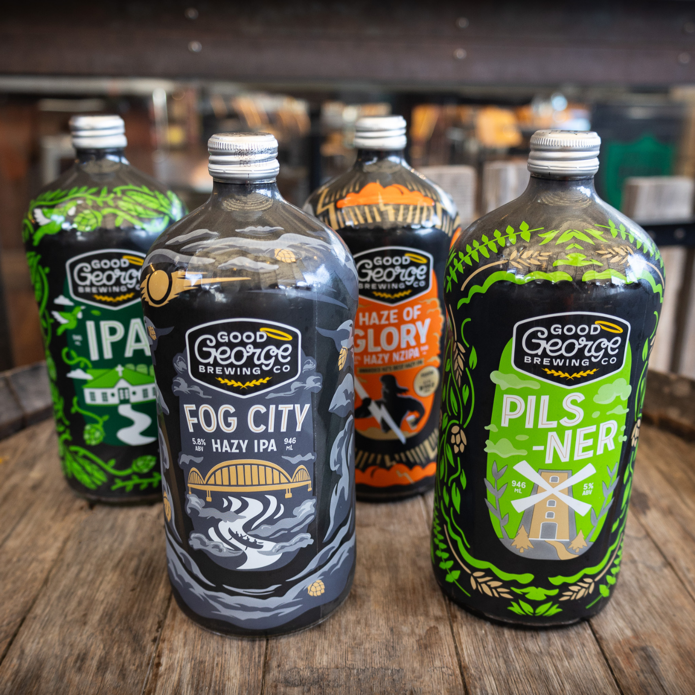 A lineup of four beer bottles from Good George's Awesome Foursome Beer Pack, featuring designs for each individual beer variety.