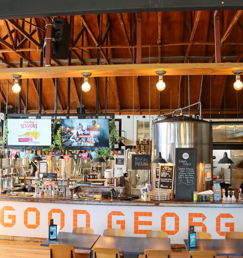 Bar with 'Good Georg' sign and wooden ceiling