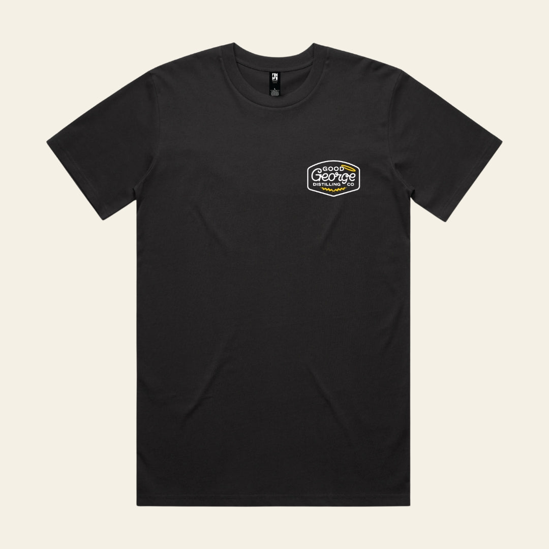 Black t-shirt with a logo on the chest against a beige background