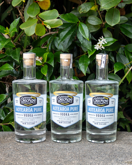 3 bottles of Aotearoa Pure Vodka bottles in a outdoor setting