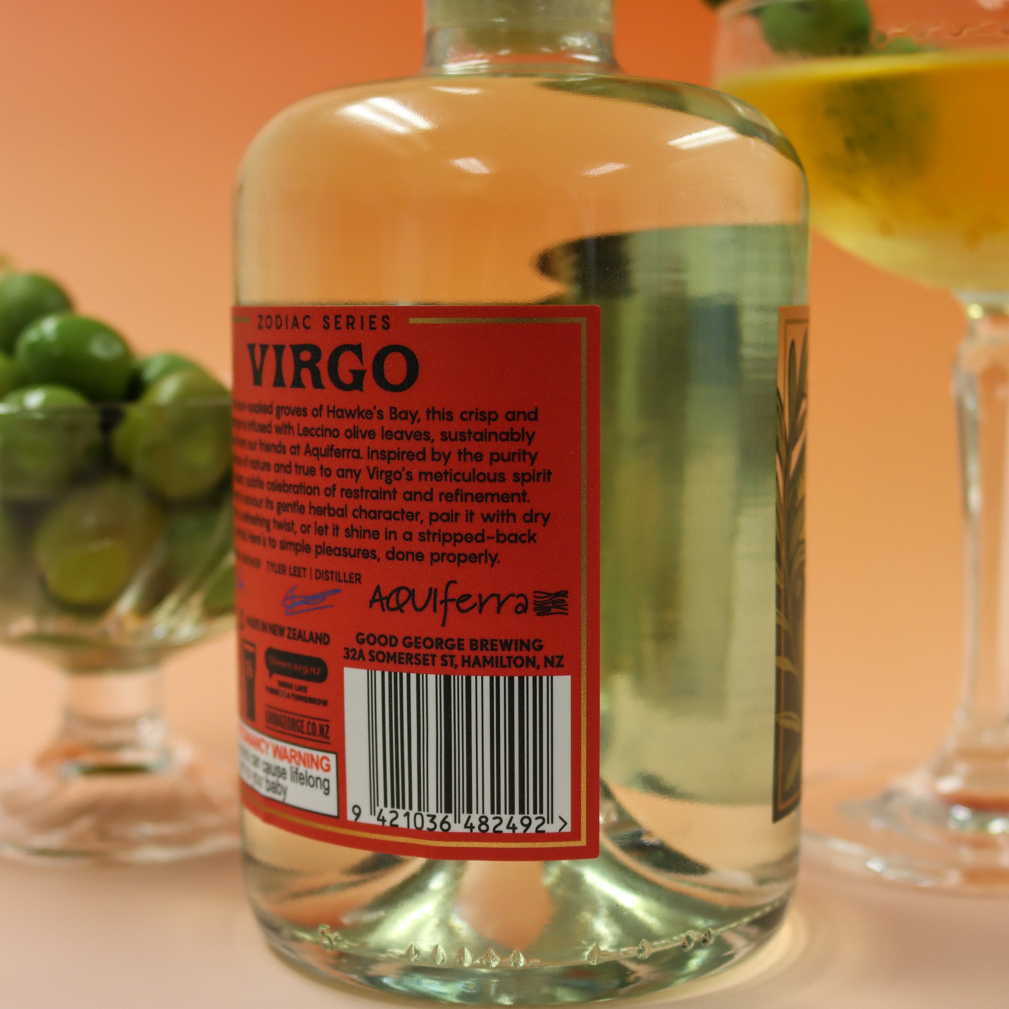 Bottle of Good George Zodiac label Virgo with a red label and a blurred background