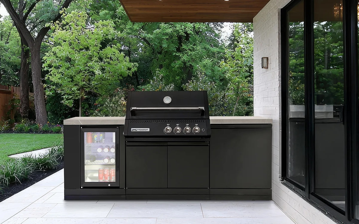 Black Crossray outdoor BBQ built into a stone-topped cabinet with an integrated glass-door bar fridge, on a covered outdoor patio.