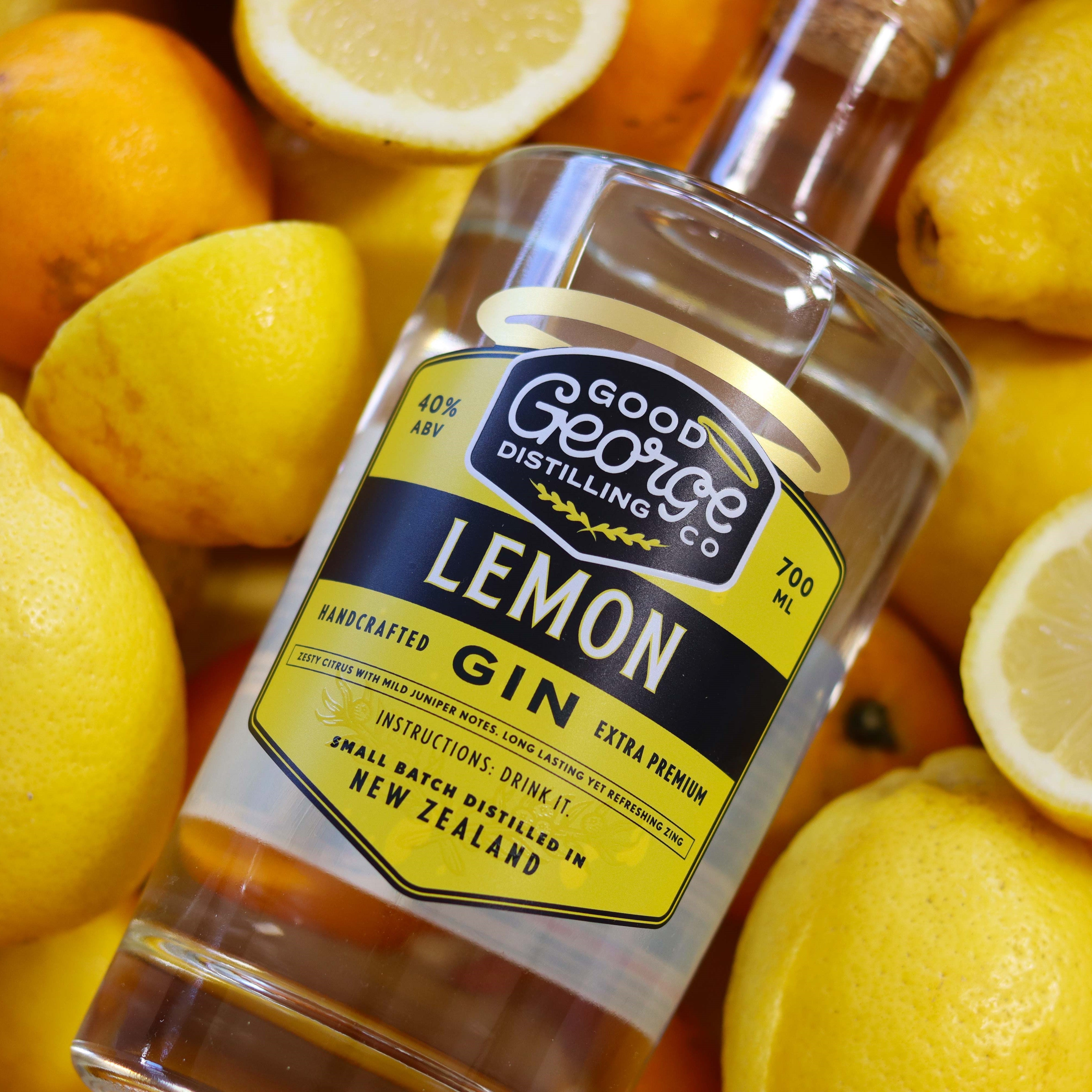 Good George Lemon Gin 700ml Bottle surrounded by lemons