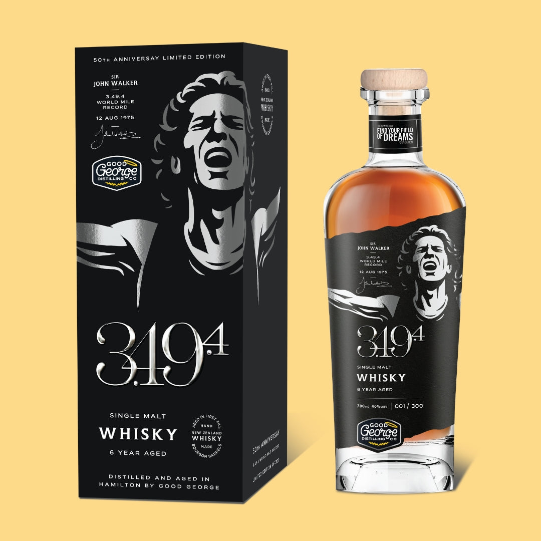 John Walker 3.49.4 whisky bottle and packaging on a yellow background
