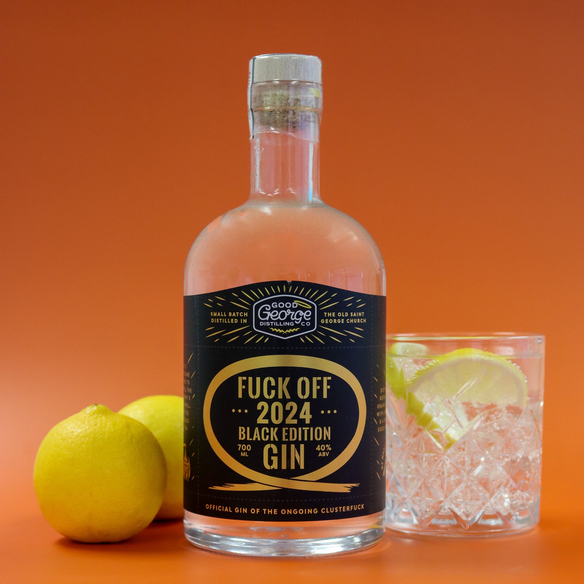 Bottle of 'Good George' Fuck Off 2024 Black Edition Gin with a glass of gin and tonic on an orange background
