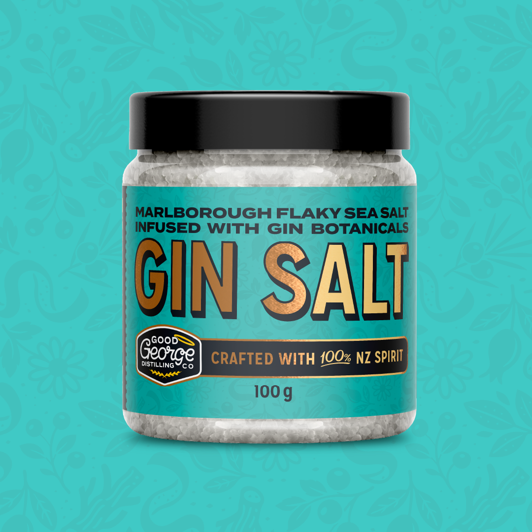 Jar of Gin Salt with a black lid on a teal background