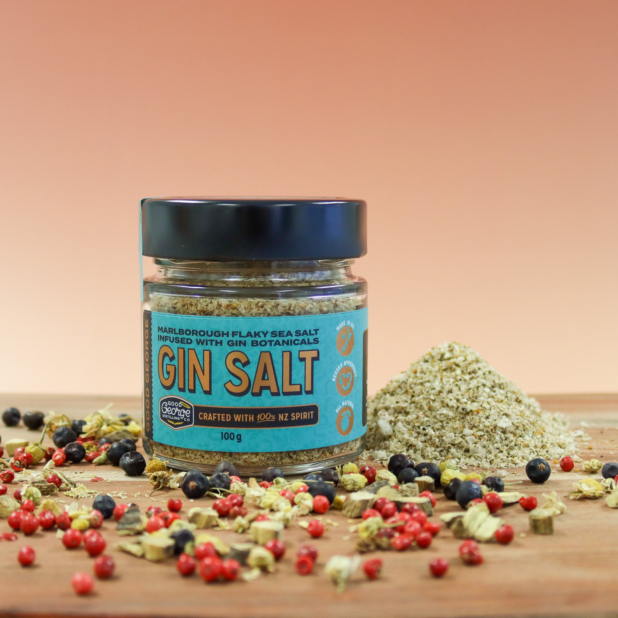 Jar of Gin Salt with botanicals on a wooden surface