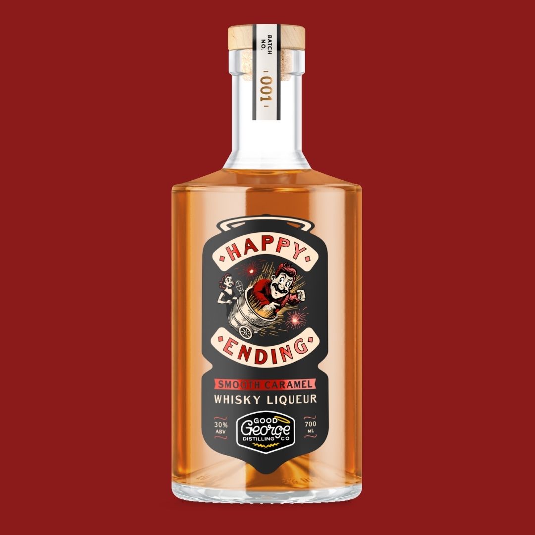 A bottle of Happy Ending Smooth Caramel Whisky Liqueur by Good George Distillers, filled with amber liquid, set against a solid dark red background.