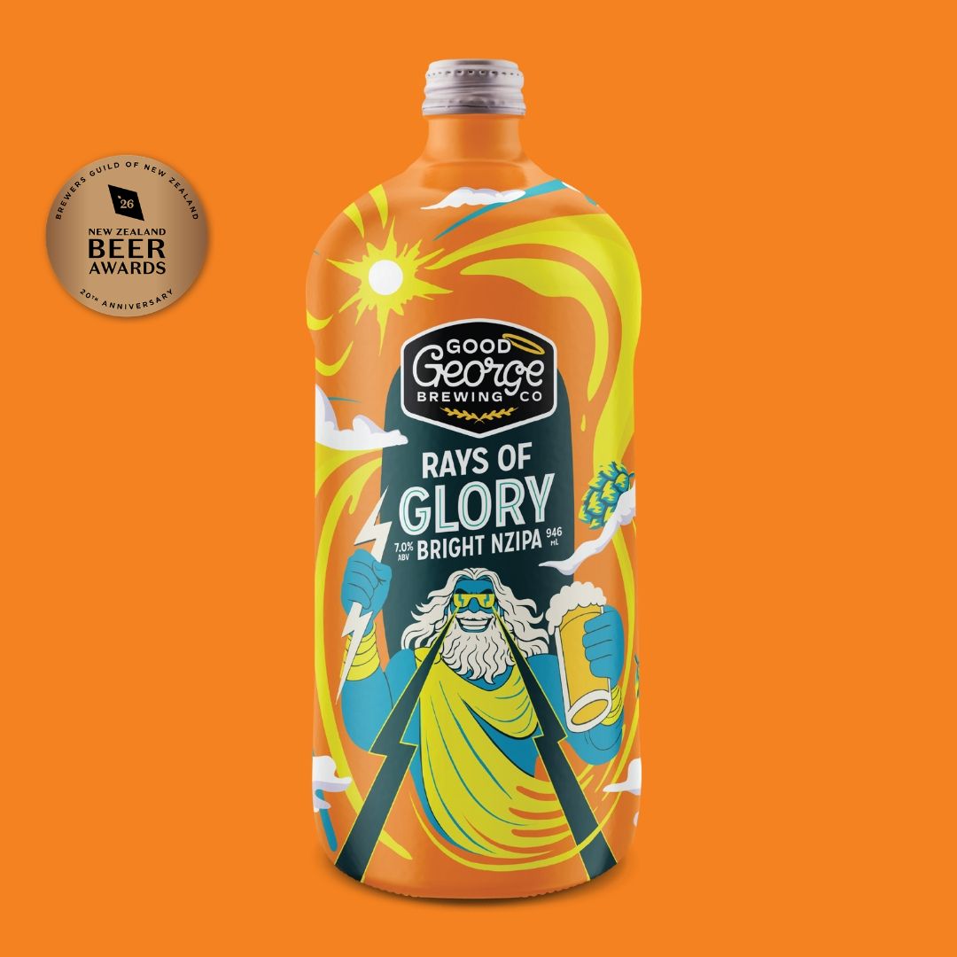 A bottle of Good George Brewing Co. 'Rays of Glory' IPA on a solid orange background, featuring a colorful label with a cartoon figure and award badge.