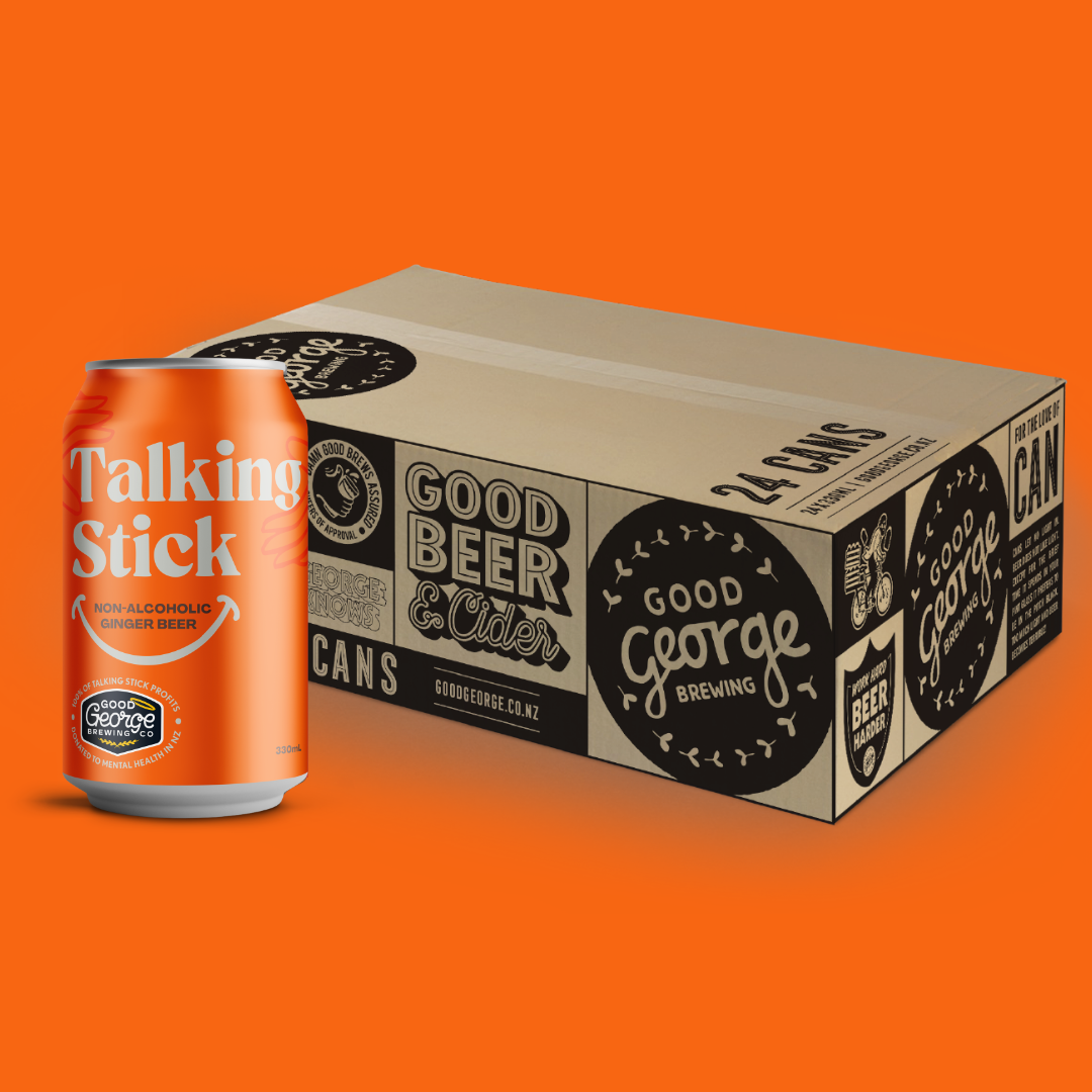 Orange can of 'Talking Stick' beer next to a cardboard box on an orange background