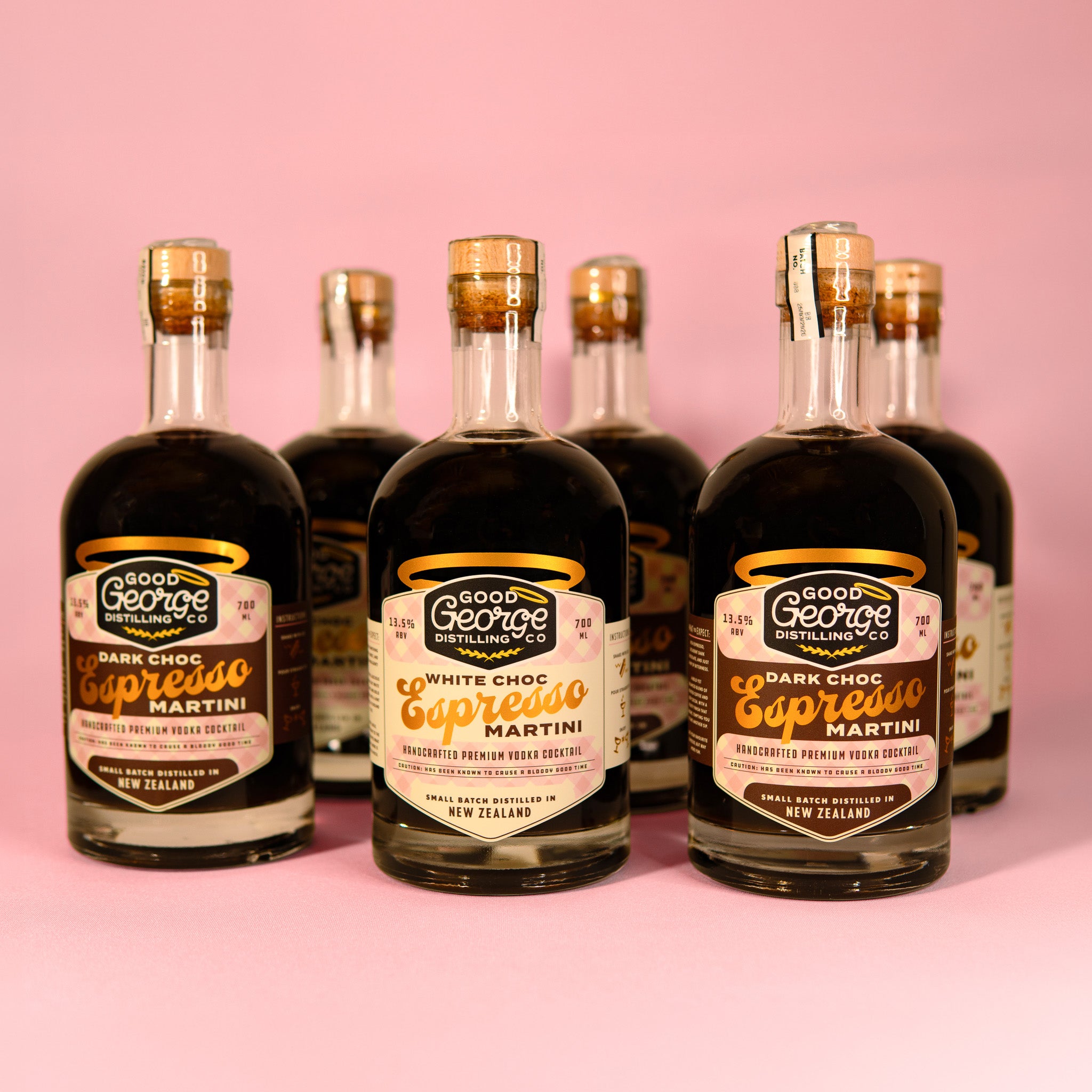 Bottles of Good George Espresso Liqueur on a pink background