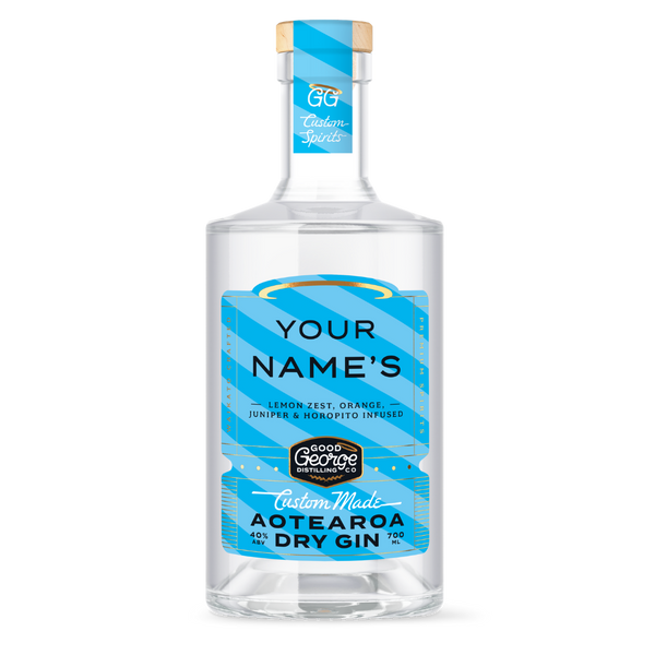 Clear gin bottle with blue label on a white background