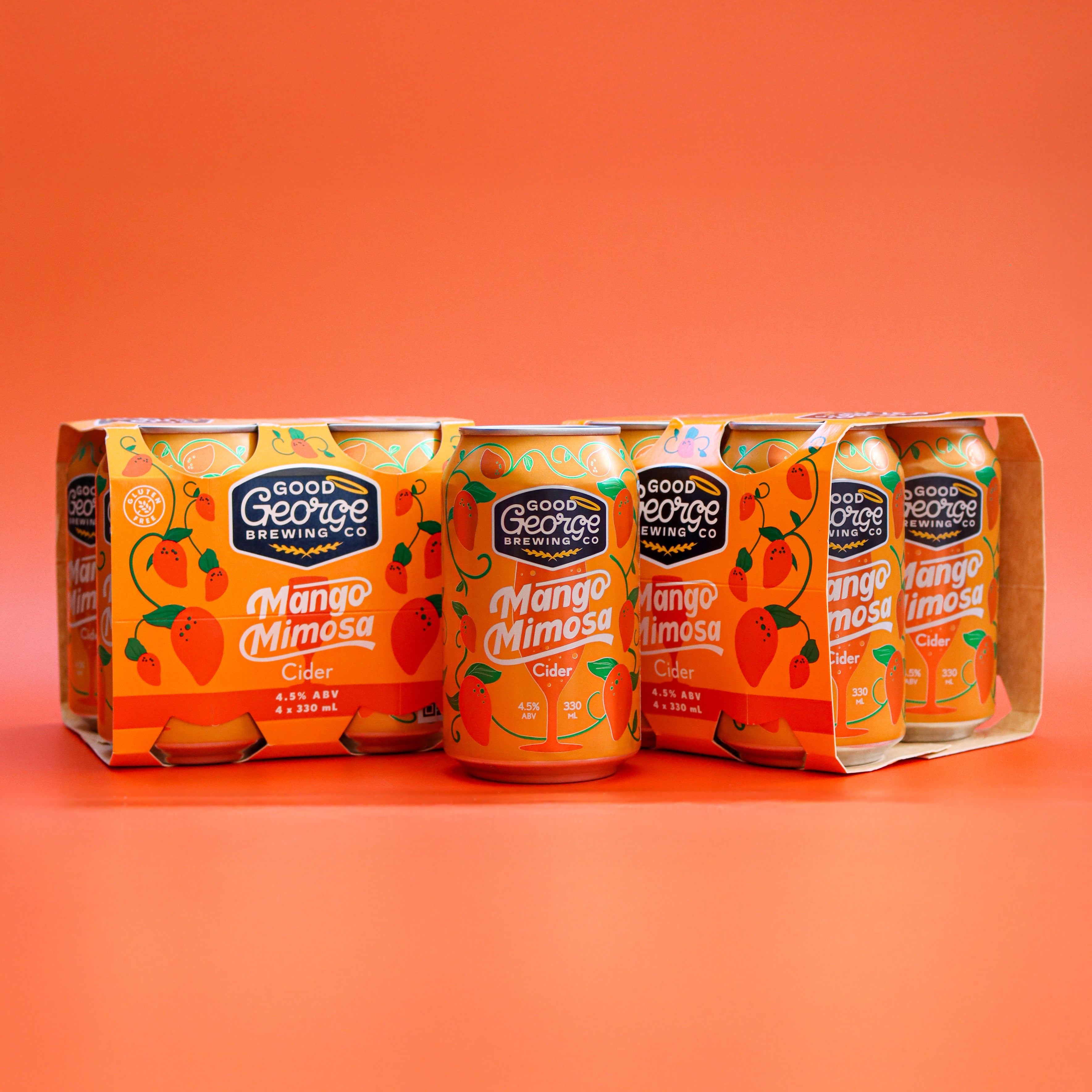 Pack of Good George Mango Mimosa Cider cans on an orange background