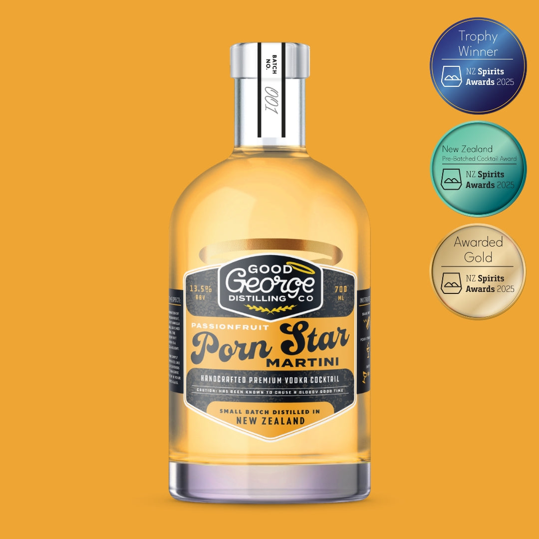Bottle of Good George Distilling Co. Porn Star Martini on a yellow background with awards displayed.