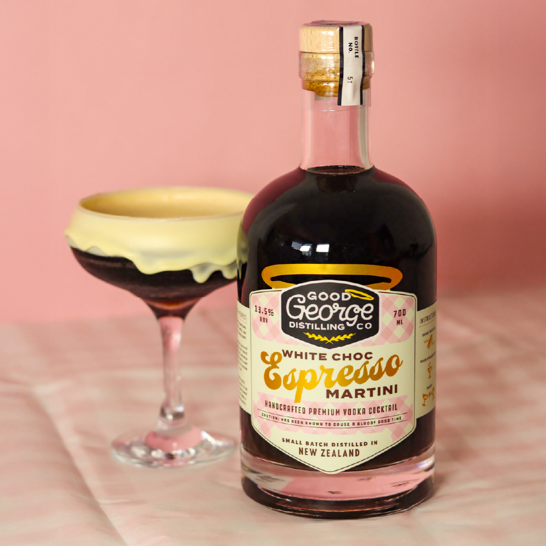 Bottle of Good George Distilling Co. White Choc Espresso Martini with a cocktail glass on a pink background