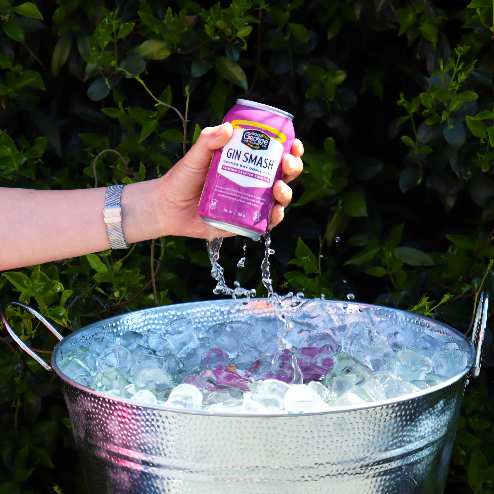 Good George Gin Smash Can getting grabbed out of the ice bucket