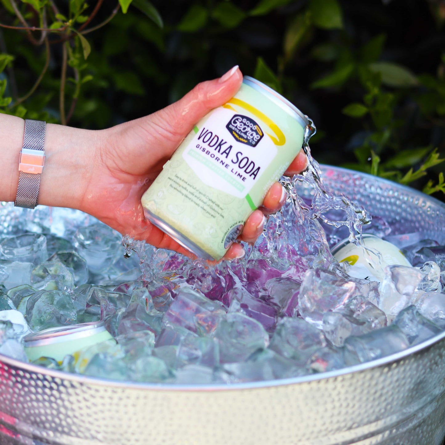 Good George Vodka Soda Lime  330ml Can getting taken out of the ice bucket